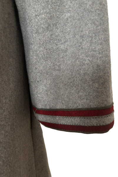 Detail view of 1960s vintage heavy gray and rust tie waist wool coat by Carol Cohen for Braefair, size medium to large. Showing the wide cuff with rust wool striping.