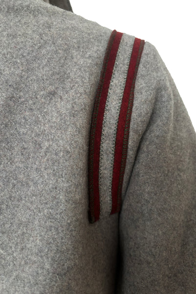 Detail view of 1960s vintage heavy gray and rust tie waist wool coat by Carol Cohen for Braefair, size medium to large. Showing the rust wool striping at the back shoulder.
