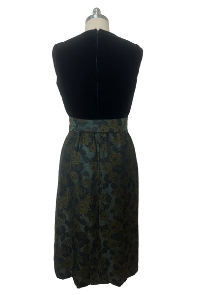 Back view of 1950s vintage black velvet crew neck, sleeveless, green floral brocade pencil skirt cocktail dress, with beaded belt, size medium to large.