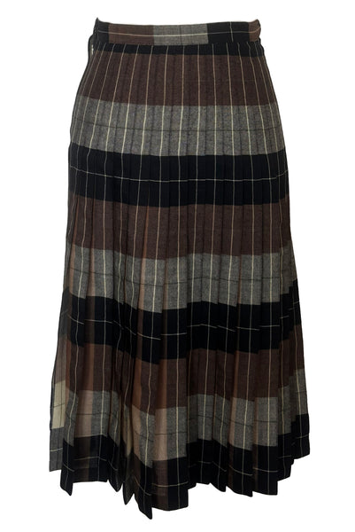 Front view of 1970s vintage reversible black, tan, cream, and green wool plaid pleated midi skirt by Charlotte Ford for Classique Collection, size medium to large. Showing the darker side.