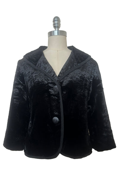 Front view of 1950s vintage black faux Persian lamb embossed velvet jacket, by Specialty House Fashion, size small to medium.