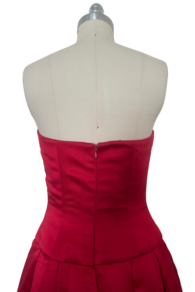 Bodice back view of 1990s strapless sweetheart pleated bodice full pleated red peau de soie satin evening gown by AJ Bari, size extra small to small.