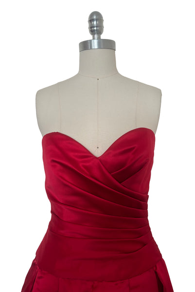 Bodice front view of 1990s strapless sweetheart pleated bodice full pleated red peau de soie satin evening gown by AJ Bari, size extra small to small. Showing a close-up of the pleated, wrapped bodice.
