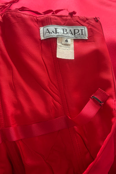 Interior detail view of 1990s strapless sweetheart pleated bodice full pleated red peau de soie satin evening gown by AJ Bari, size extra small to small. Showing the interior of the bodice with the boning and waist stay.