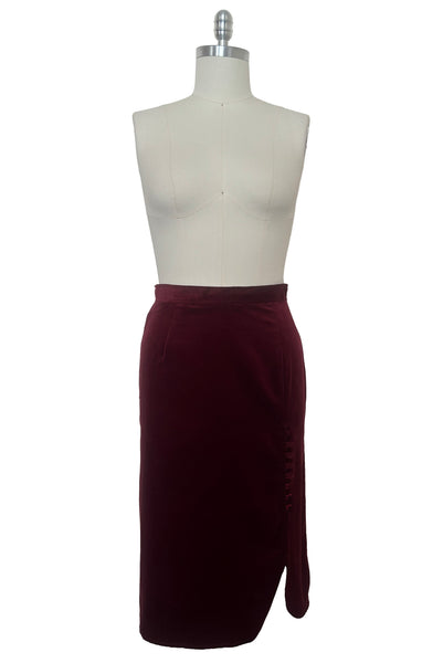 Front view of 1970s vintage burgundy velveteen button front pencil skirt, size medium to large.