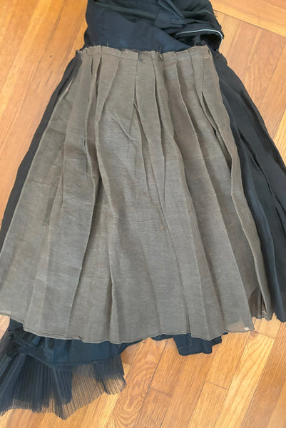 Interior detail view of 1950s vintage sleeveless New Look style black tulle silk ribbon dress by Dance Time, size extra small to small. Showing the interfacing underskirt with one faded panel.