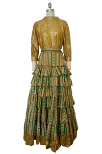 Front view of 1960s vintage green & gold brocade and Lurex costume top and skirt set, size small to medium.