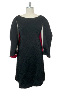 Front view of 1960s vintage black matelassé jacquard Mod cocktail dress and red satin lined wrap, size medium to large.