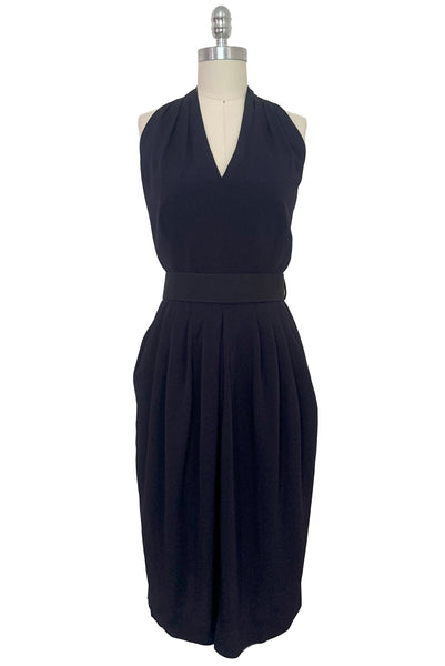 Front view of 1990s vintage navy blue crepe V-neck, keyhole back dress with draped skirt and belt by BB Collections, medium to large.