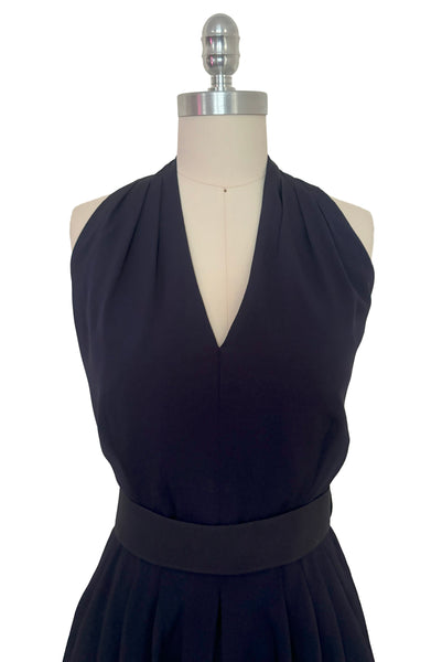 Bodice front view of 1990s vintage navy blue crepe V-neck, keyhole back dress with draped skirt and belt by BB Collections, medium to large. Showing the V-neck halter neckline.