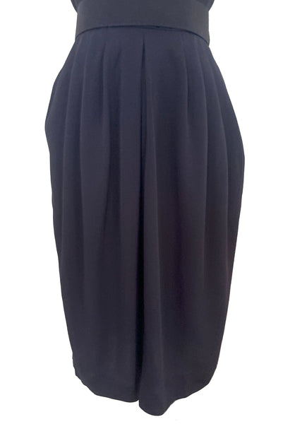 Skirt detail view of 1990s vintage navy blue crepe V-neck, keyhole back dress with draped skirt and belt by BB Collections, medium to large. Showing the pleated draped skirt.