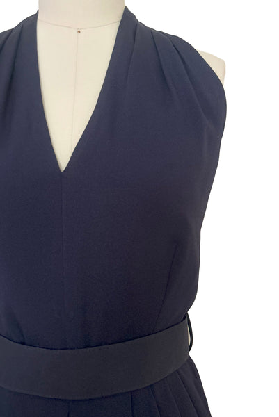 Bodice front detail view of 1990s vintage navy blue crepe V-neck, keyhole back dress with draped skirt and belt by BB Collections, medium to large. Showing the V-neck halter neckline, and belt.