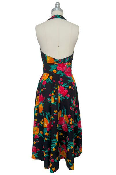 Back view of vintage 1990s black, pink, green, and yellow floral halter dress with matching belt by Concepts, extra small to small.