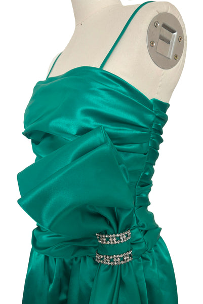 Bodice side view of 1980s vintage emerald green satin rhinestone trimmed ruched evening dress, by Lillie Rubin, size extra extra small to extra small.