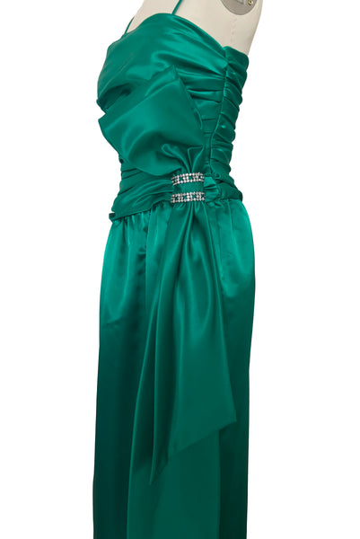 Side view of 1980s vintage emerald green satin rhinestone trimmed ruched evening dress, by Lillie Rubin, size extra extra small to extra small.
