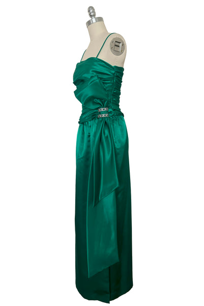 Side view of 1980s vintage emerald green satin rhinestone trimmed ruched evening dress, by Lillie Rubin, size extra extra small to extra small.