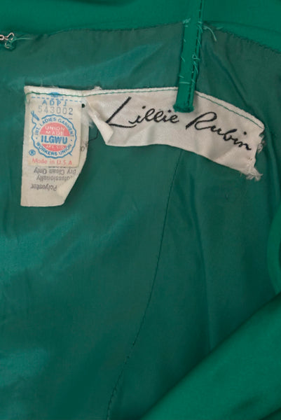 Interior detail view of 1980s vintage emerald green satin rhinestone trimmed ruched evening dress, by Lillie Rubin, size extra extra small to extra small. Showing the Lillie Rubin  and union label.