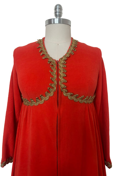 Bodice front view of 1960s  vintage orange fleece zip front housecoat w/ gold metallic braid by Periphery, size medium to large.