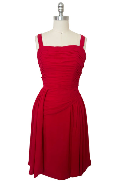 Front view of 1960s vintage draped raspberry pink silk chiffon cocktail dress by Miss Bonwit, size extra small to small.