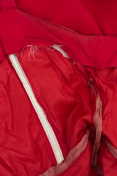 Interior detail view of 1960s vintage draped raspberry pink silk chiffon cocktail dress by Miss Bonwit, size extra small to small. Showing the synthetic underlining and boning.