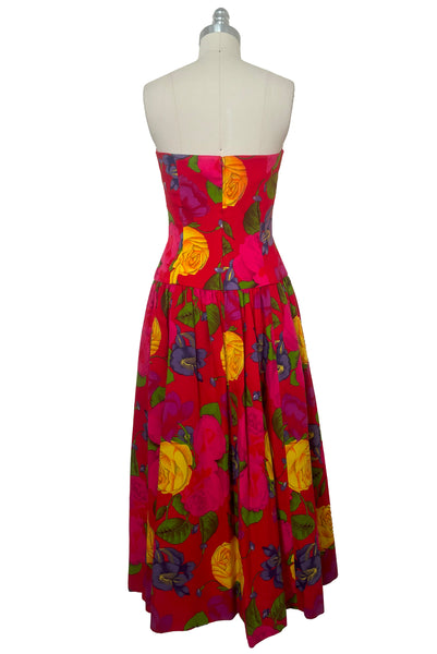Back view of 1990s vintage red, pink, yellow, green, and purple floral strapless dress by AJ Bari, size small to medium.