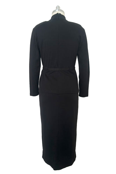 Back view of 1990s black mockneck wool blend sweater dress with peplum by Liz Claiborne, medium to large.