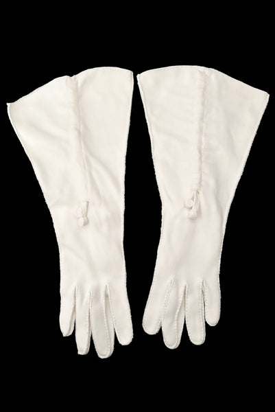Vertical front view of 1930s vintage cream mid length gathered tie detail gauntlet gloves, by Picairdy Stitch.