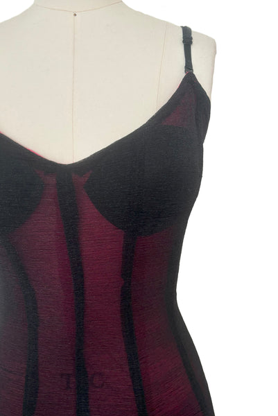 Detail view of 2000s vintage hot pink & black ruffled mesh dance dress costume, size small to medium. Showing a snag in the knit