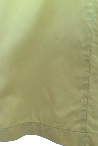 Detail view of 1990s vintage chartreuse cotton snap front dress with lacing details by designer Thierry Mugler, size extra small to small. Showing the lacing details.