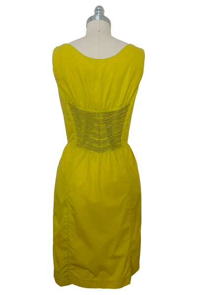 Back view of 1990s vintage chartreuse cotton snap front dress with lacing details by designer Thierry Mugler, size extra small to small.