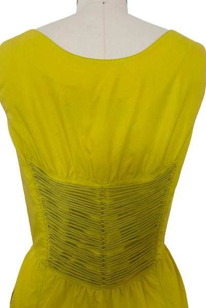 Bodice back view of 1990s vintage chartreuse cotton snap front dress with lacing details by designer Thierry Mugler, size extra small to small. Showing the lacing details.