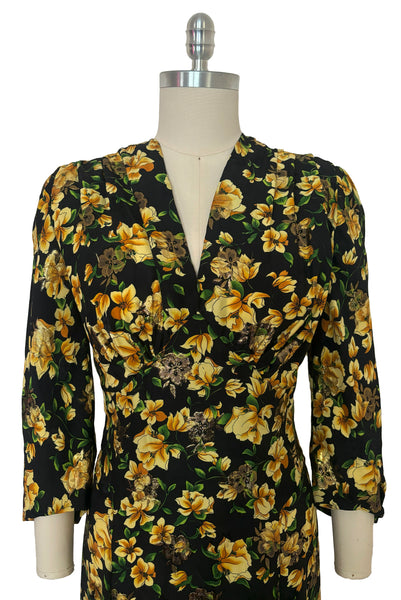 Bodice front view of vintage 2000s made 1940s reproduction black, yellow, and gold floral silk and lurex evening dress, size medium to large. Showing the v-neckline and 3/4 bias cut sleeves.