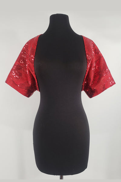 Hand-crafted in New Orleans, the Leslie Courreges Eleanor Bolero features red sequins with Lurex metallic red threading highlighting an intricate deco design. 