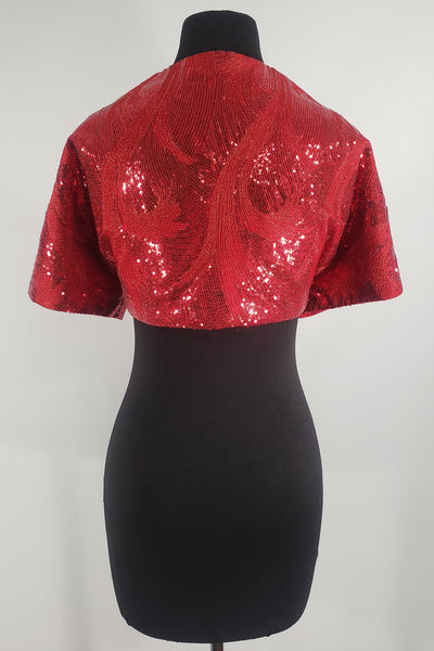 Hand-crafted in New Orleans, the Leslie Courreges Eleanor Bolero features red sequins with Lurex metallic red threading highlighting an intricate deco design. 