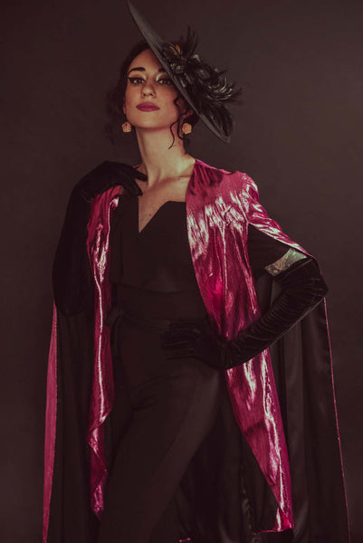 The Leslie Courreges Dietrich Cape marries the best features of a blazer and a cape, with tailored shoulders, a shorter “blazer” that hits below the hips and a sweeping “cape” hitting knee-length.