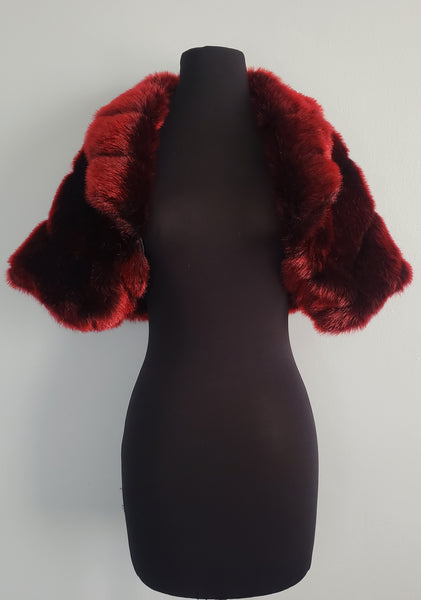 The Leslie Courreges Anita Bolero features deep inky black faux mink with crimson red tips.