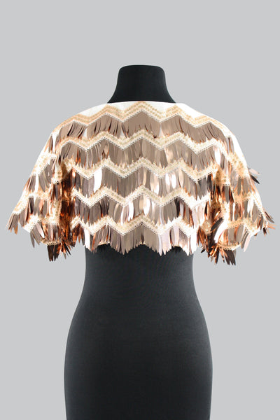 The Leslie Courreges Eleanor Bolero features gold sequins against blush embroidery with rose gold fringe sequins. 